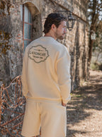 Buttergelber Oversized-Pullover mit Landschaftsmotiv