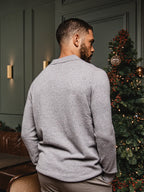 Grau melierter Wollpullover mit V-Ausschnitt