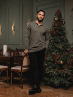 Grün melierter Wollpullover mit V-Ausschnitt