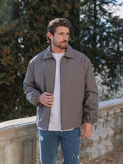 Graue wattierte Coach-Jacke mit Reißverschluss