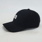 Schwarze Wollflickenmütze