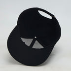 Schwarze Wollflickenmütze