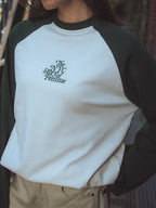 Grünes Langarmshirt mit Raglanärmeln