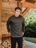 Grüner Oversize-Pullover mit charakteristischem Muster